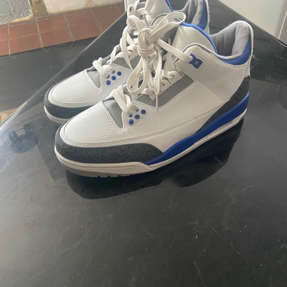 Jordan White and Blue Athletic Shoes with Iconic Design